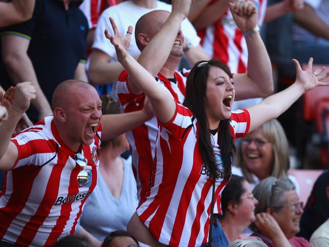 Sunderland fans react after hearing that Newcastle United are losing during the Premier League match between Sunderland and Chelsea at the Stadium of Light on May 24, 2009.