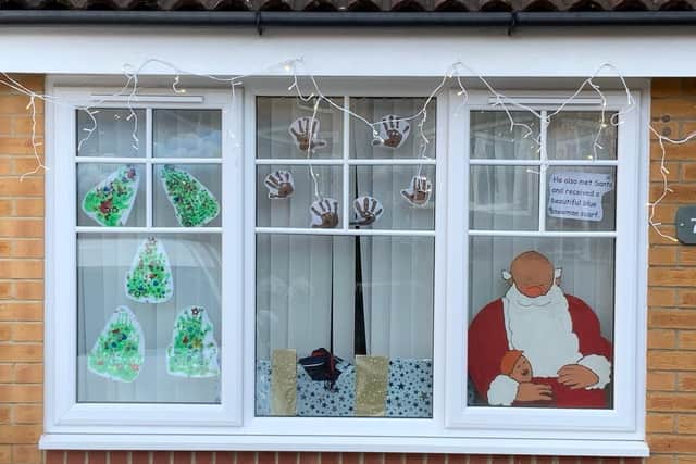 Each household took a scene from the story and decorated the windows of their homes in the hope of raising funds for The People’s Kitchen. Image by Paul Merton.