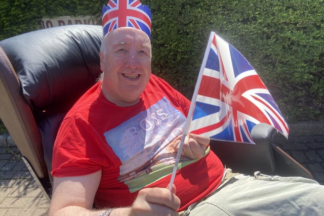 James Macugh waving the flag on Thursday, June 2 as Jubilee celebrations begin.