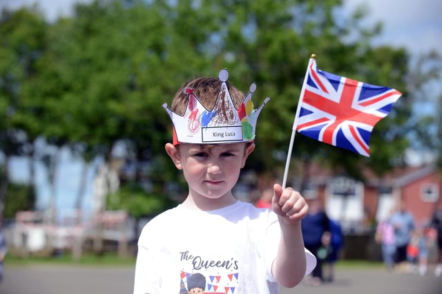 Town End Academy pupil Luca McCowie, 5, with his celebratory crown and flag.
