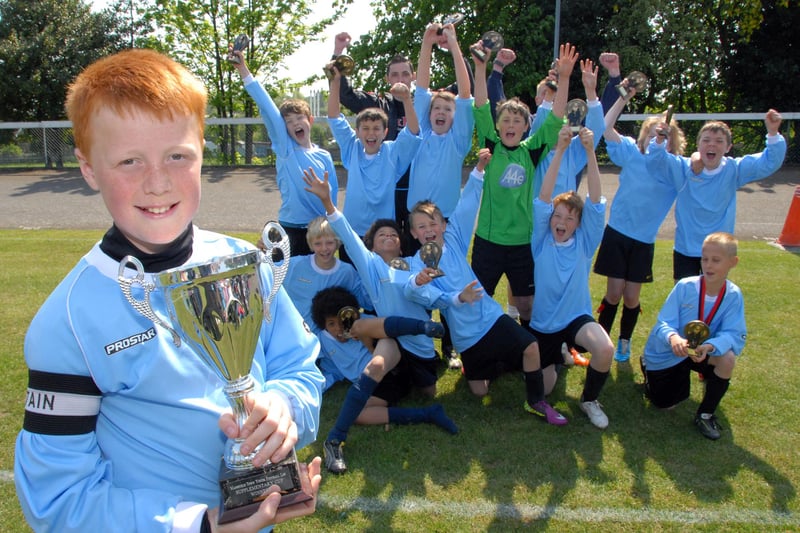 Captain Trey Foster (12) with the Rainworth Rangers team celebrate after winning 2-1 against Glapwell Gladiators in their Under 12 Division 2 final.