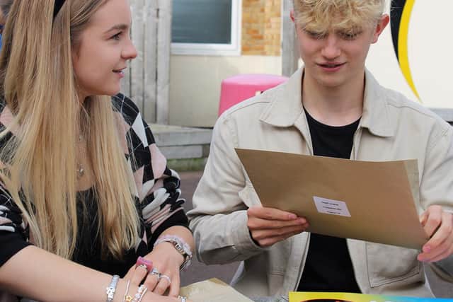 Nieve Howat and Jonathan Cowgill, both 16, opening their GCSE results.