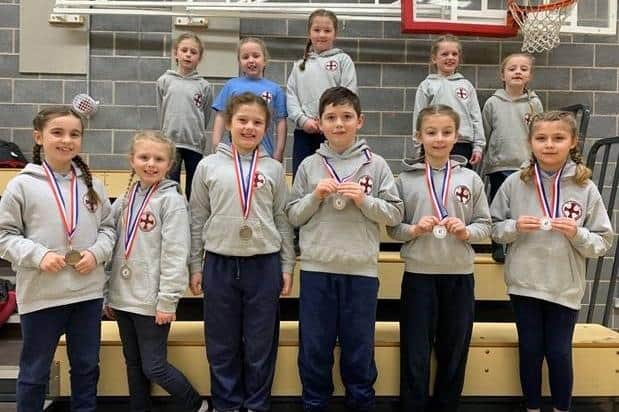 St Cuthbert’s Catholic Primary School pupils show off some of their medals.