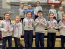 St Cuthbert’s Catholic Primary School pupils show off some of their medals.