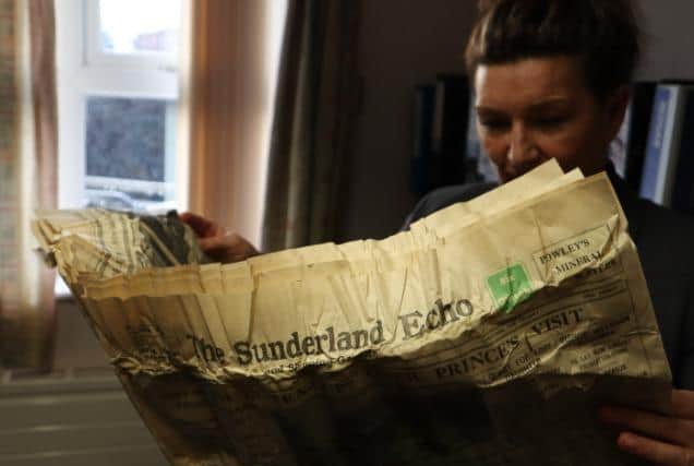 Lynne Brandt of CNTW, engrossed in the 1930 Sunderland Echo contained in the time capsule.