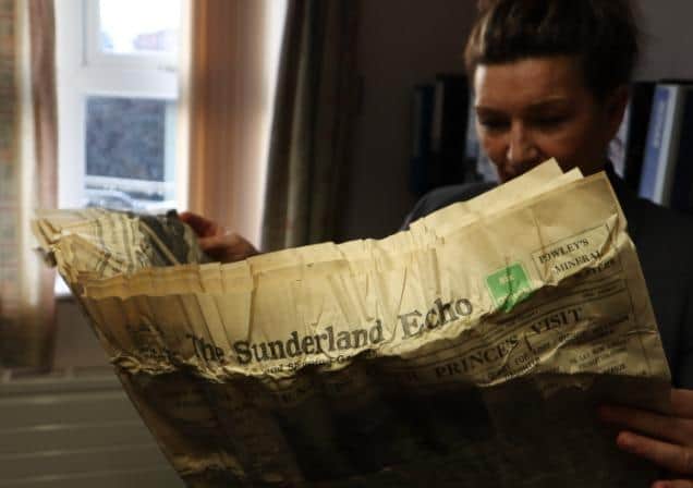 Lynne Brandt of CNTW, engrossed in the 1930 Sunderland Echo contained in the time capsule.