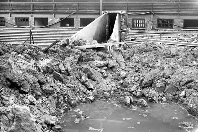 A bomb from a German air raid made this crater in front of the players' tunnel in May 1943. A policeman outside was killed.