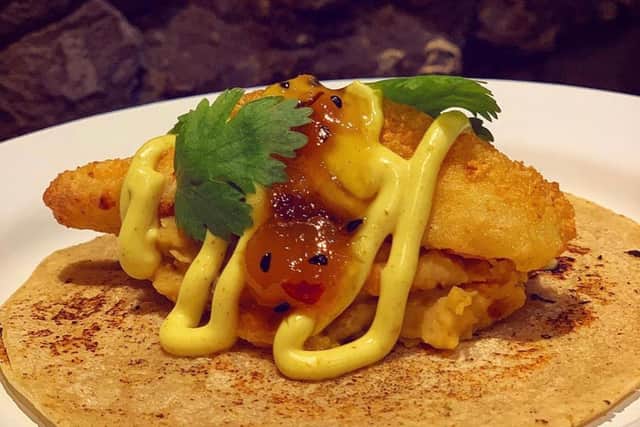 Buttermilk madras fried chicken taco with lentil dahl and mango chutney.