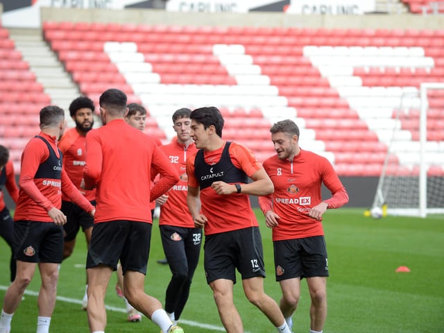 Sunderland players warming up for their open training session.