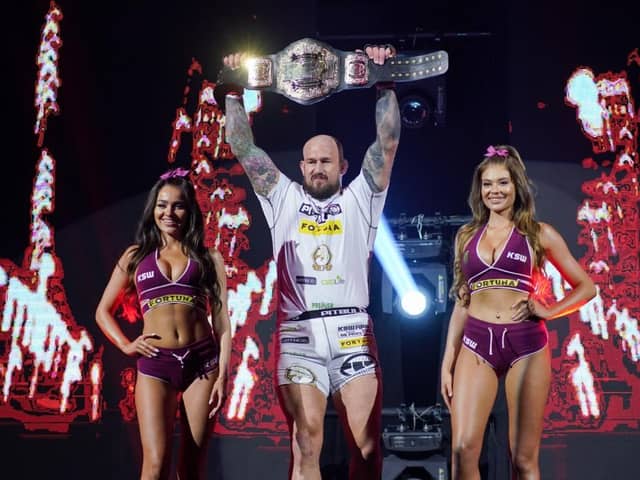 Phil lifting the heavyweight belt at his last title defence. Photo courtesy of KSW