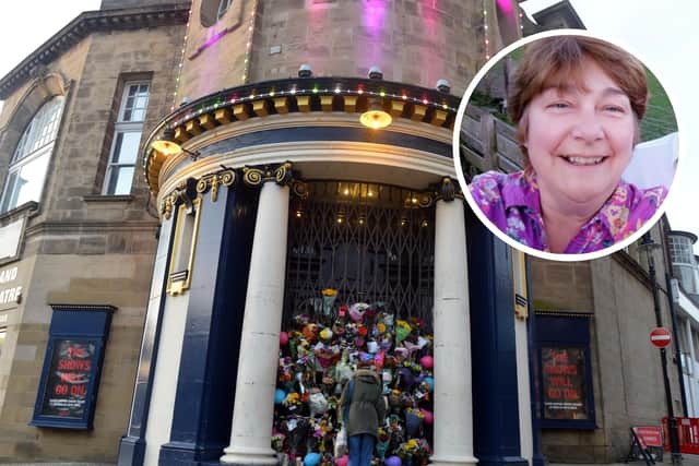 Floral tributes have been left outside of the Empire Theatre in memory of staff member Dorothy Cansfield