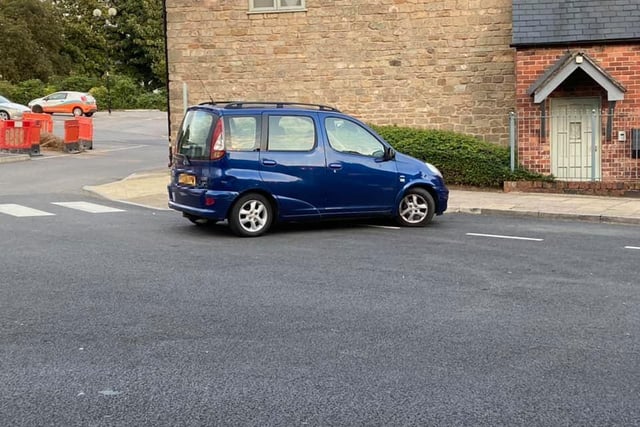 This driver chose to ignore the fact that the parking space is adjacent to the curb, instead opting to park front facing instead.