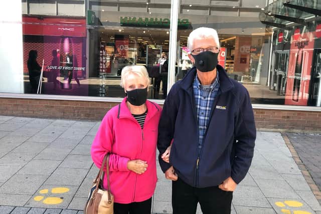 Retired couple Ernie and Joyce Coates believe wearing masks is a good thing.