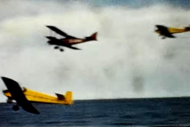 In close formation and within feet of the beach in this film footage recorded by Bob Wingate.