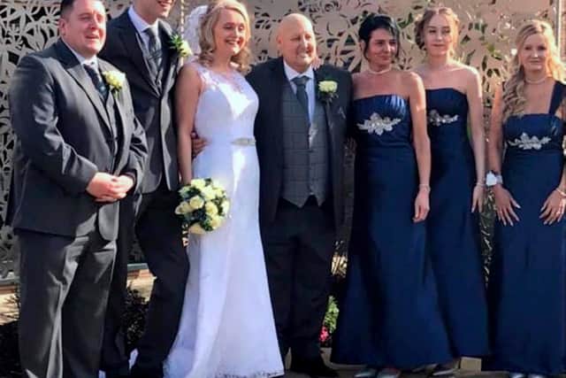 Terminal cancer patient Chris Clark, 43, who hosted his own wake last month to say goodbye to friends and family, and has now fulfilled his dying wish by marrying his "rock", partner Claire, 46, in a registry office ceremony in South Shields.