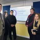 Consilium Evolve headteacher Robert Bell celebrates the school's good Ofsted report with staff and students.
