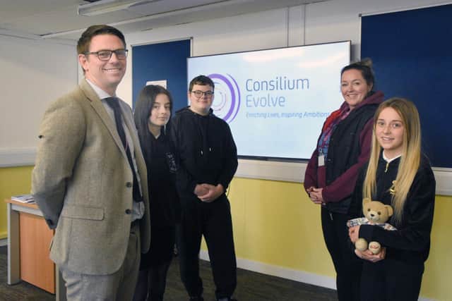 Consilium Evolve headteacher Robert Bell celebrates the school's good Ofsted report with staff and students.