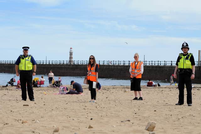 Sunderland City Council enforcement officer Marina Hallam and Natalie Moore, with PCSO Graham Dinning and PC Martin Smith, at Roker Beach.