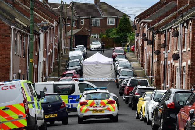 Police forensic officers survey the scene following a suspected stabbing on Melville Street in Chester-le-Street.