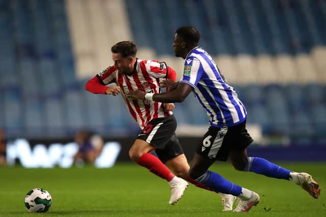 Sunderland's Patrick Roberts (left) and Sheffield Wednesday's Dominic Iorfa battle for the ball. PA picture.