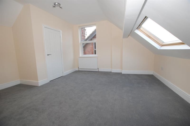 In the attic space is an additional larger bedroom with large en suite.