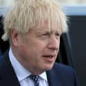 Boris Johnson reacts as he greets members of the public while campaigning on behalf of Conservative Party candidate Jill Mortimer (unseen) ahead of the 2021 Hartlepool by-election to be held on May 6 on May 3, 2021 in Hartlepool, north-east England. (Photo by Lindsey Parnaby - WPA Pool/Getty Images)