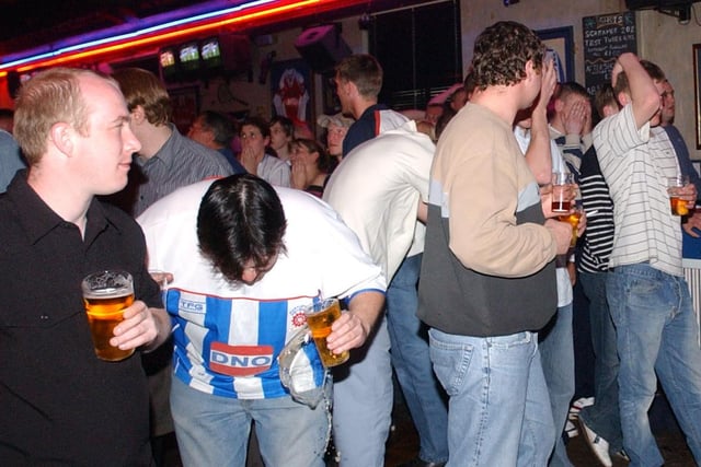 One last reminder of Pools fans watching their team in 2004.