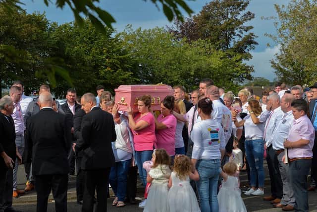 A huge number of people turned out to pay their respects to the cousins at their funeral in Northern Ireland.