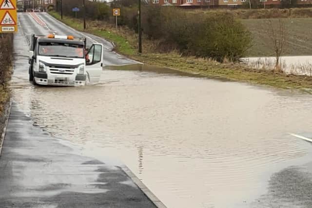 Van struggles through flooding on Murton Lane.