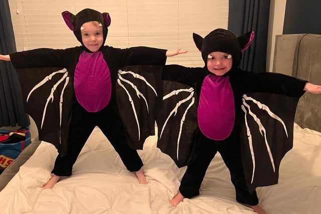 Rudy and Ada, ages 5 and 3, are on bat patrol this Halloween.