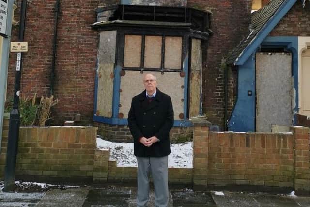 Cllr Michael Dixon outside a property in the city's Tunstall Terrace.