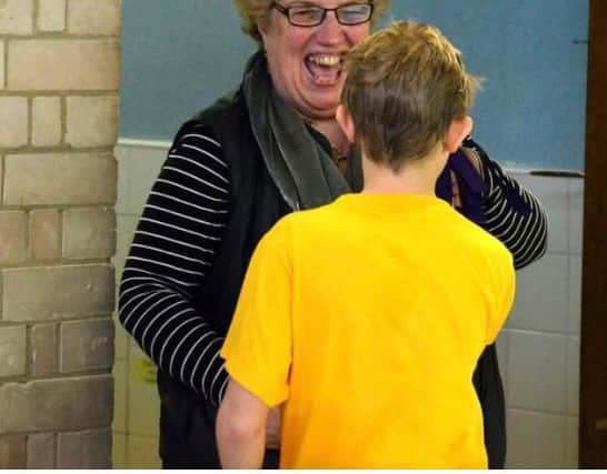 Monkwearmouth Academy PE teacher Liz Graham shares a joke with a student. Liz, 66, sadly passed away last month having been diagnosed with breast cancer.