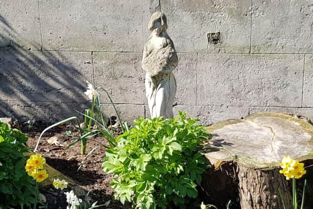 The statue stolen from the garden.