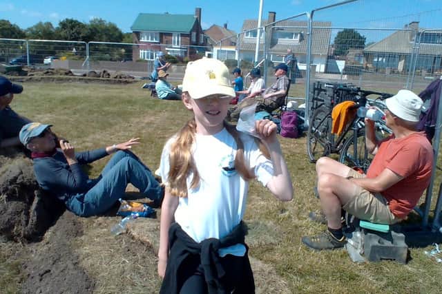 Isabelle Clish, nine, with the bagged up necklace bead she found which has been sent off for further analysis.