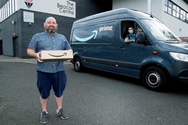Beacon Centre staff member Darren Brown with Amazon lead driver Jason Hogg in South Shields.