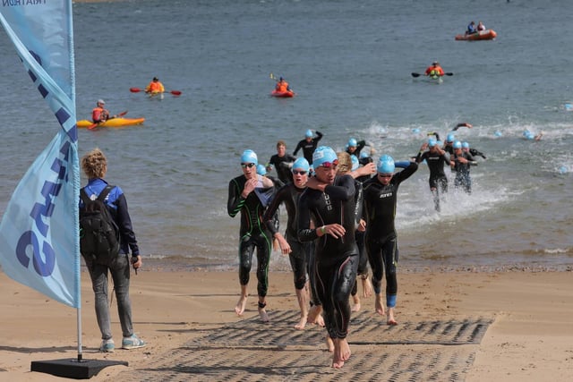 Competitors emerge from the sea