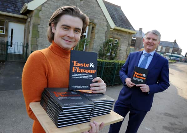 Sunderland City Council's Chief Executive Patrick Melia and Life Kitchen's Ryan Riley with the new recipe book.