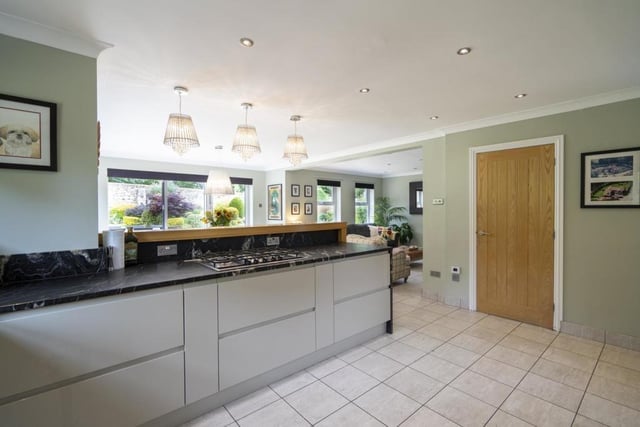 The kitchen has two sets of Bi folding door opening to the rear garden and opening to the living area.
