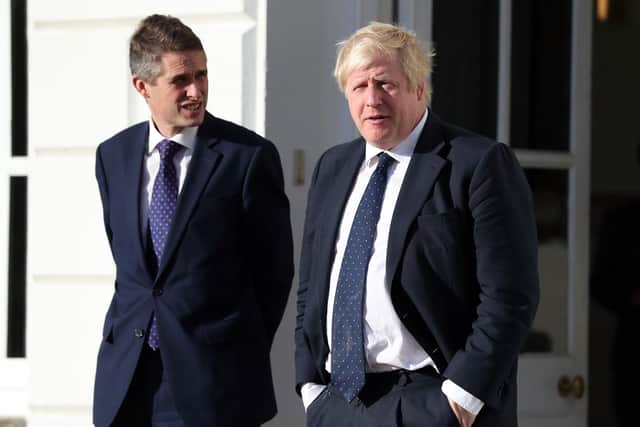 Boris Johnson with his Education Secretary Gavin Williamson. PA picture