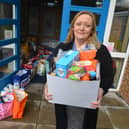 Headteacher Susan Robertson with food parcels for children who receive free school meals.
