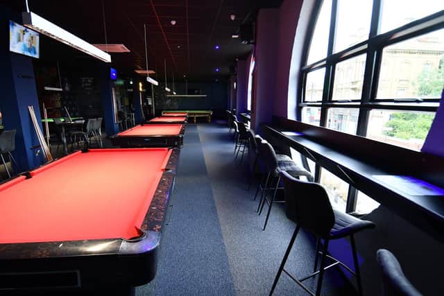 The venue has two floors of pool and snooker tables