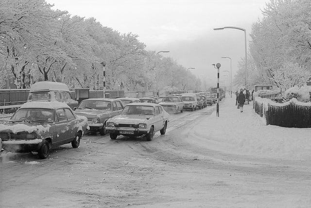 A line of cars face the snowy conditions on Newcastle Road in January 1977.