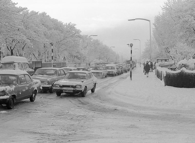 A line of cars face the snowy conditions on Newcastle Road in January 1977.