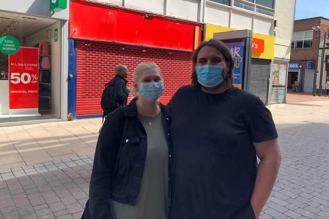 Teaching assistant Lauren Abbott and retail worker Christopher Granton wearing their masks in Sunderland this afternoon.
