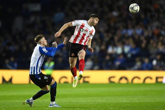 Lynden Gooch of Sunderland gets to the ball ahead of Josh Windass of Sheffield Wednesday. (Photo by Michael Regan/Getty Images).