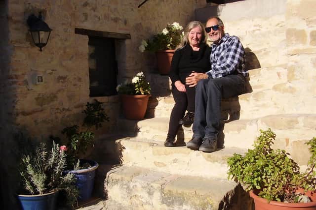 Relaxing in the sun on the doorstep of their Italian home.