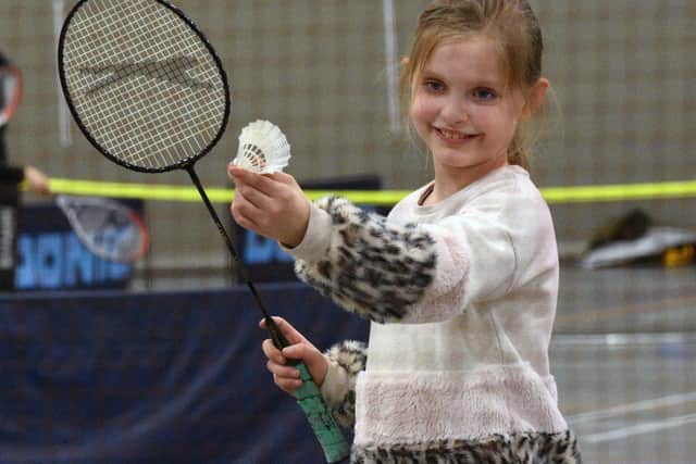 Josie Foster tries Badminton at the engaging and showcasing event at the Beacon of Light.