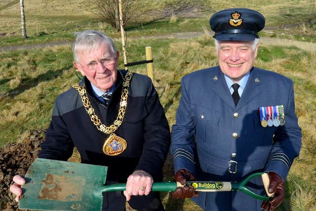 The Mayor of Sunderland Councillor Harry Truman (left) and Wing Commander David L Harris hold the ceremonial spade they used to plant a tree.