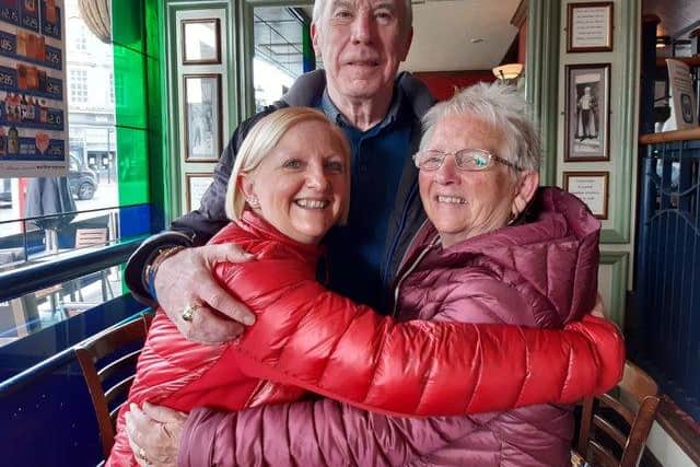 Joanne Gray with John McCowliff and Brenda Gray hugging in Wetherspoon's The William Jameson.