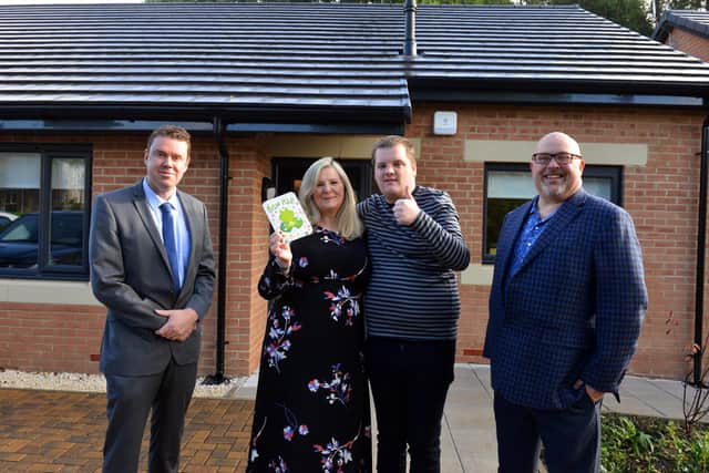 Mother Michelle Carr has praised the council for the life changing adapted bungalow for profoundly autistic son James Carr. Coun Kevin Johnston and Sunderland City Council leader Coun Graeme Miller (R).